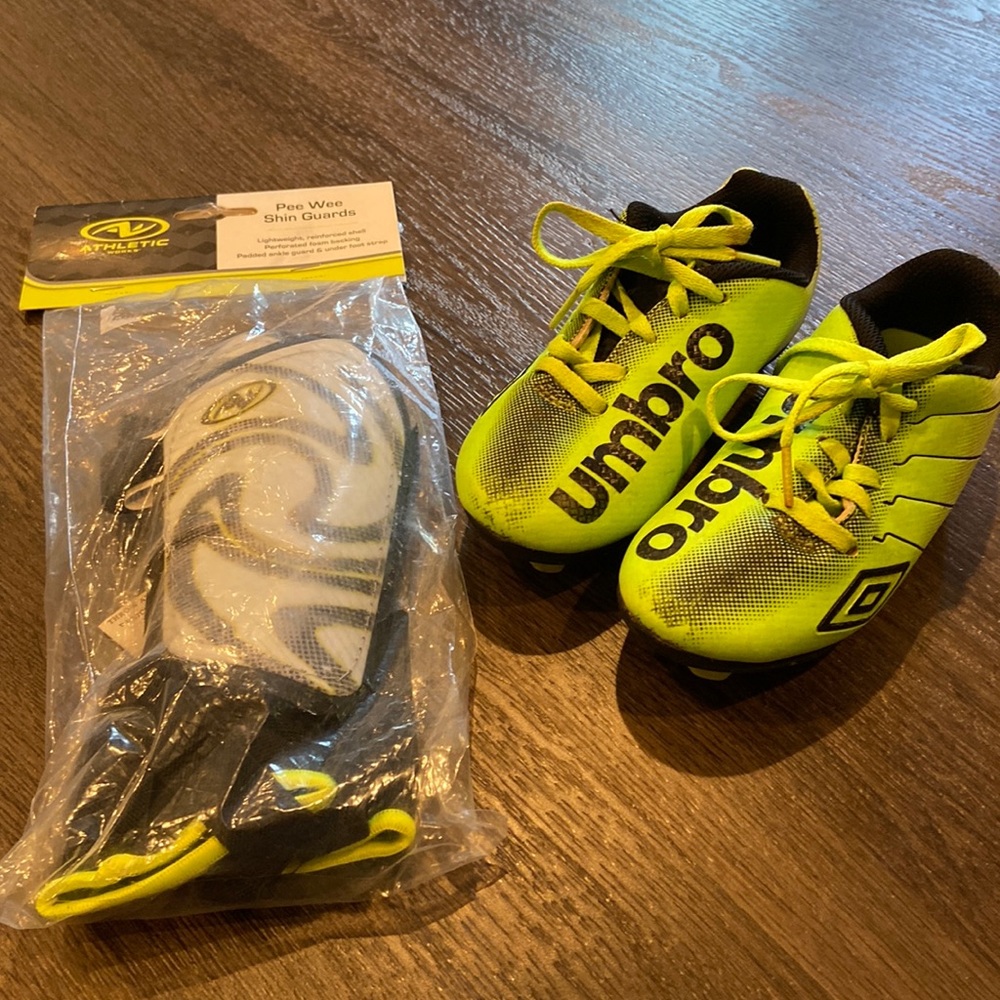 Umbro soccer cleats neon and black size 10 little kids and new shin guards